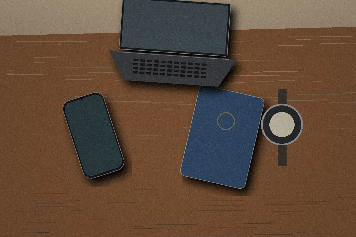 Travel desk with phone, passport, SIM items, watch, and laptop representing multiple location signals