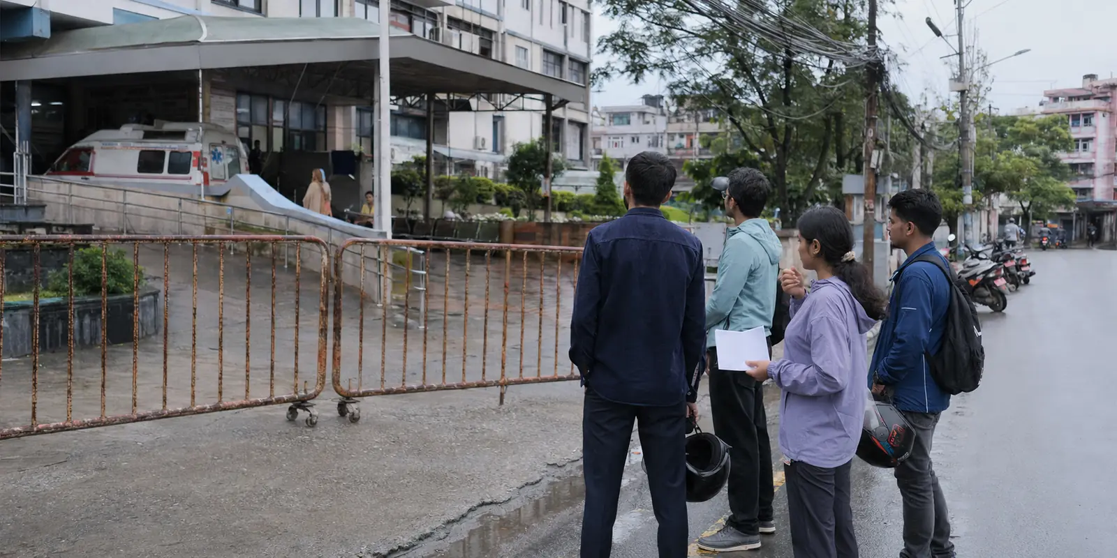 Volunteer blood donors waiting outside a blocked hospital entrance in Kathmandu