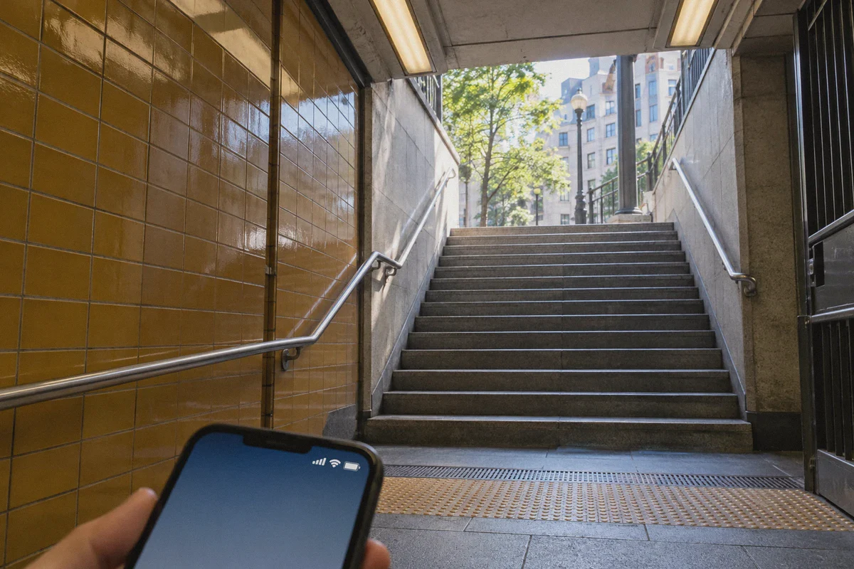 A phone near a subway exit where network availability changes.