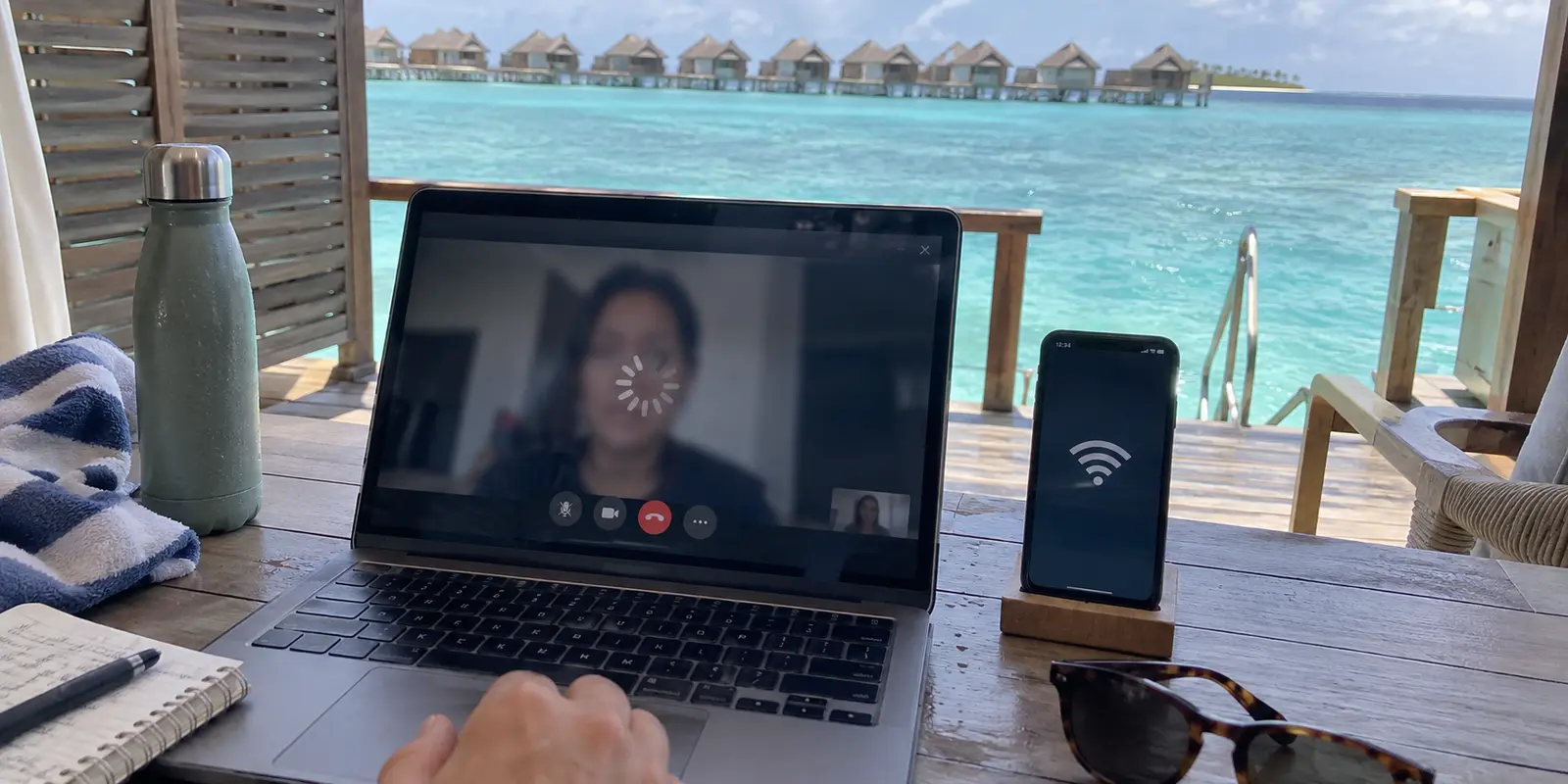 A video call buffers in an overwater bungalow even though the nearby phone shows full Wi-Fi signal.