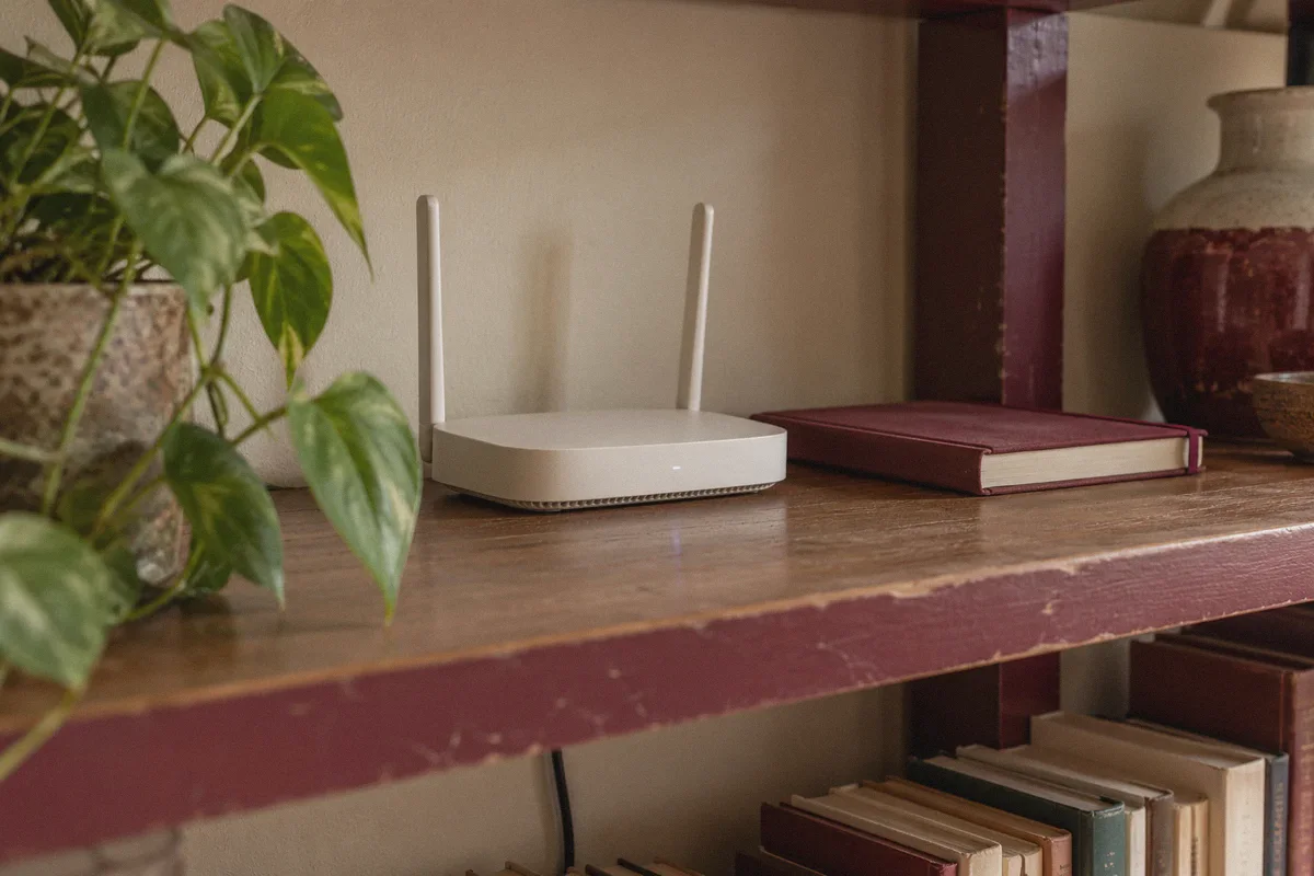 Home network access point on a bookshelf.