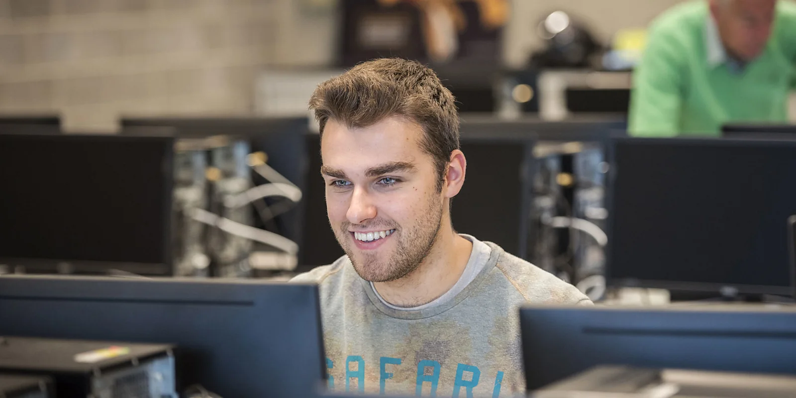 A person working at a computer workstation during a real project.