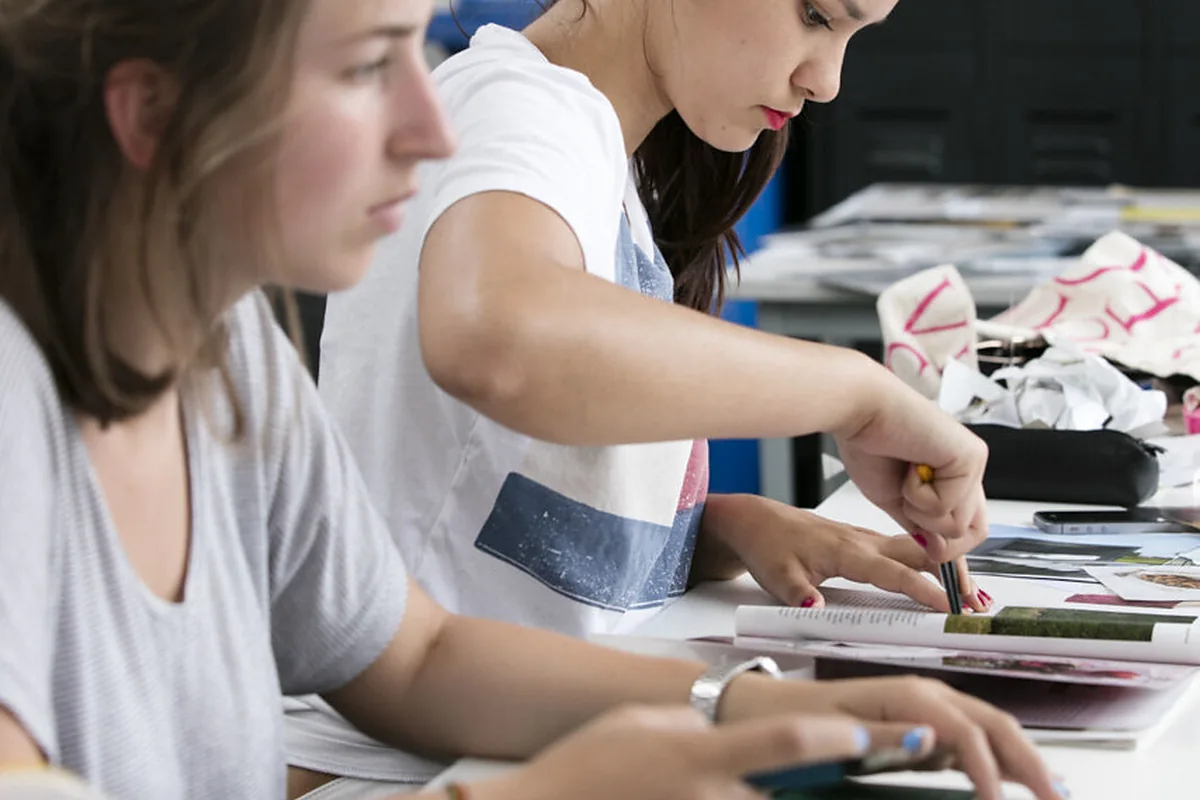 People working through a hands-on project at a shared table.