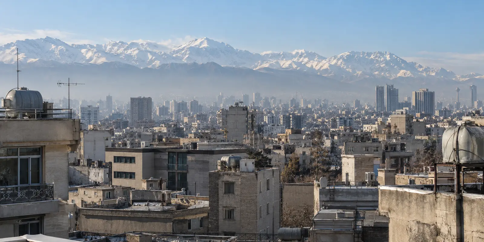 Tehran rooftops and the Alborz Mountains in clear winter light