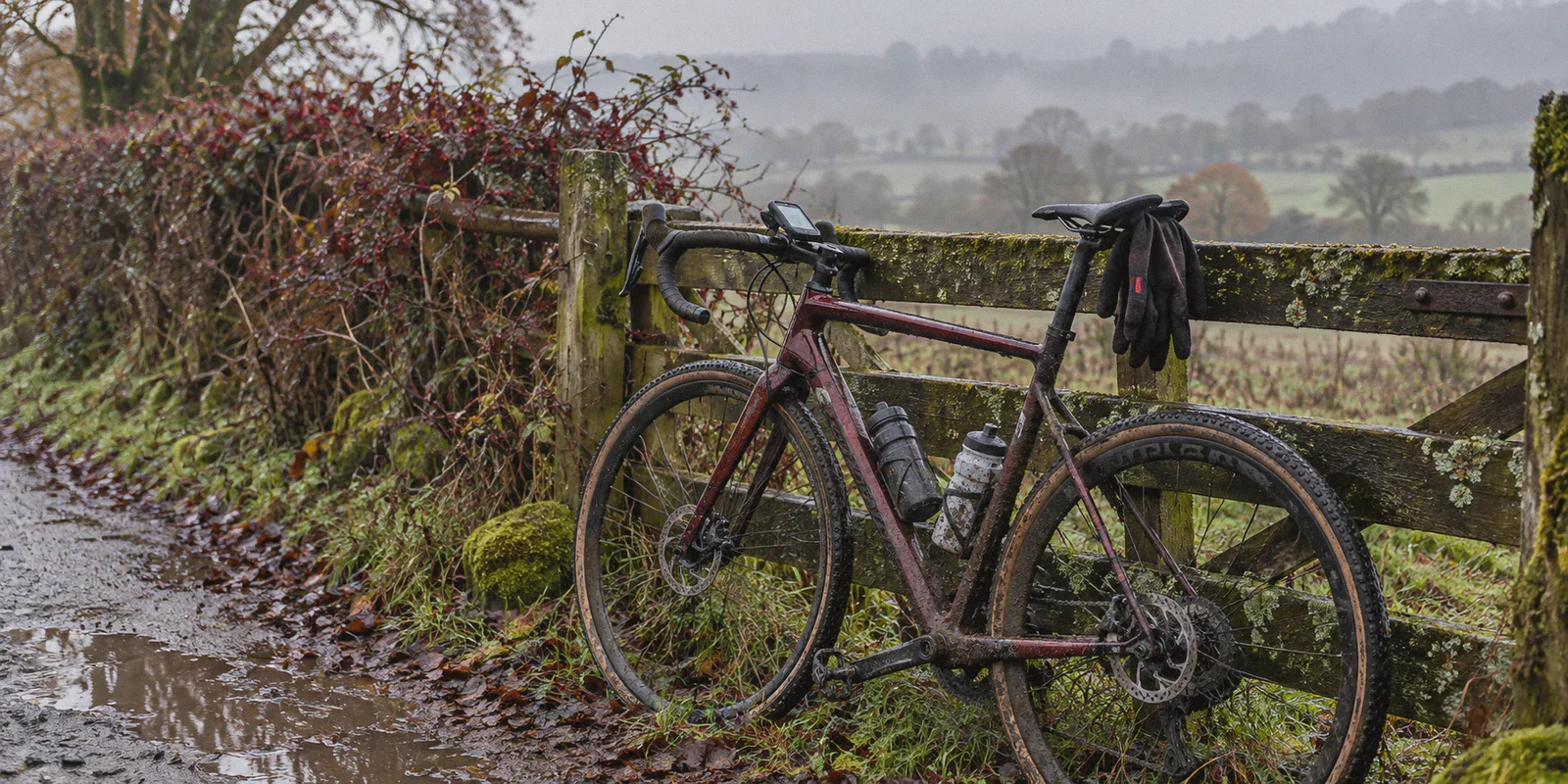 A road bicycle and cycling computer after a rainy ride.