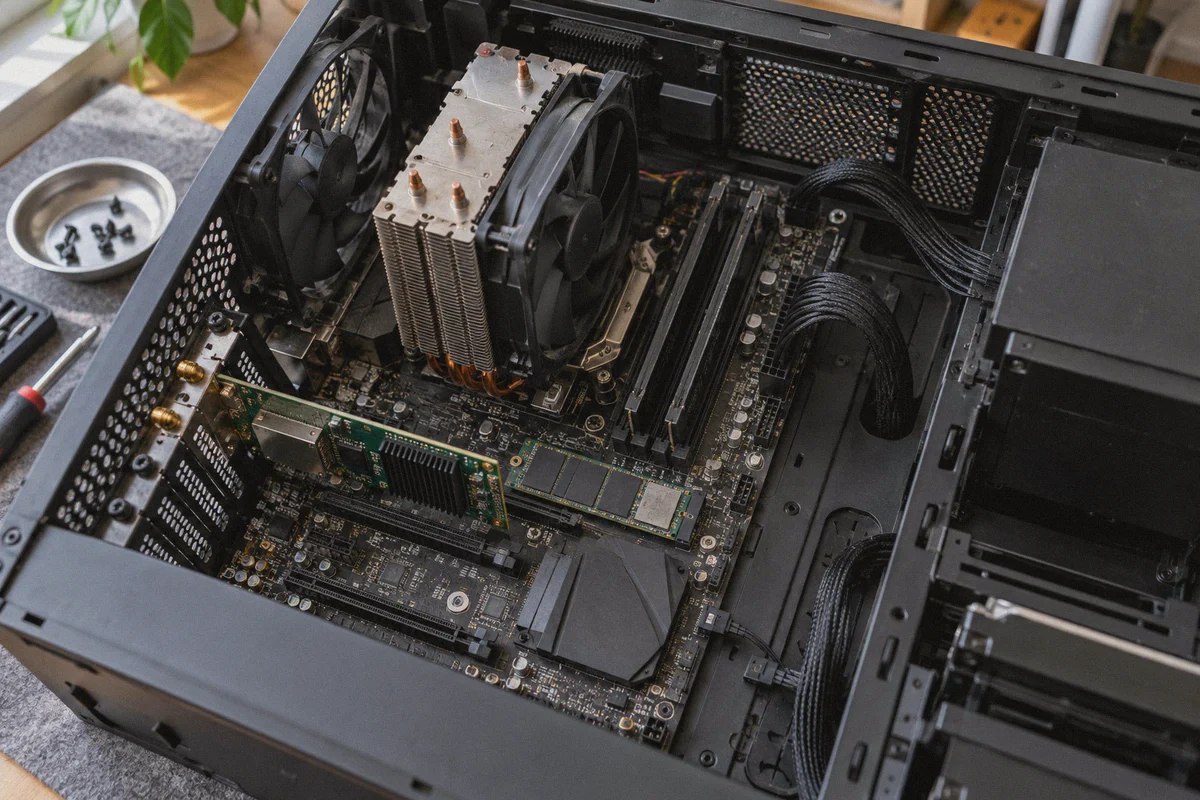 Motherboard and storage components inside an opened desktop computer.
