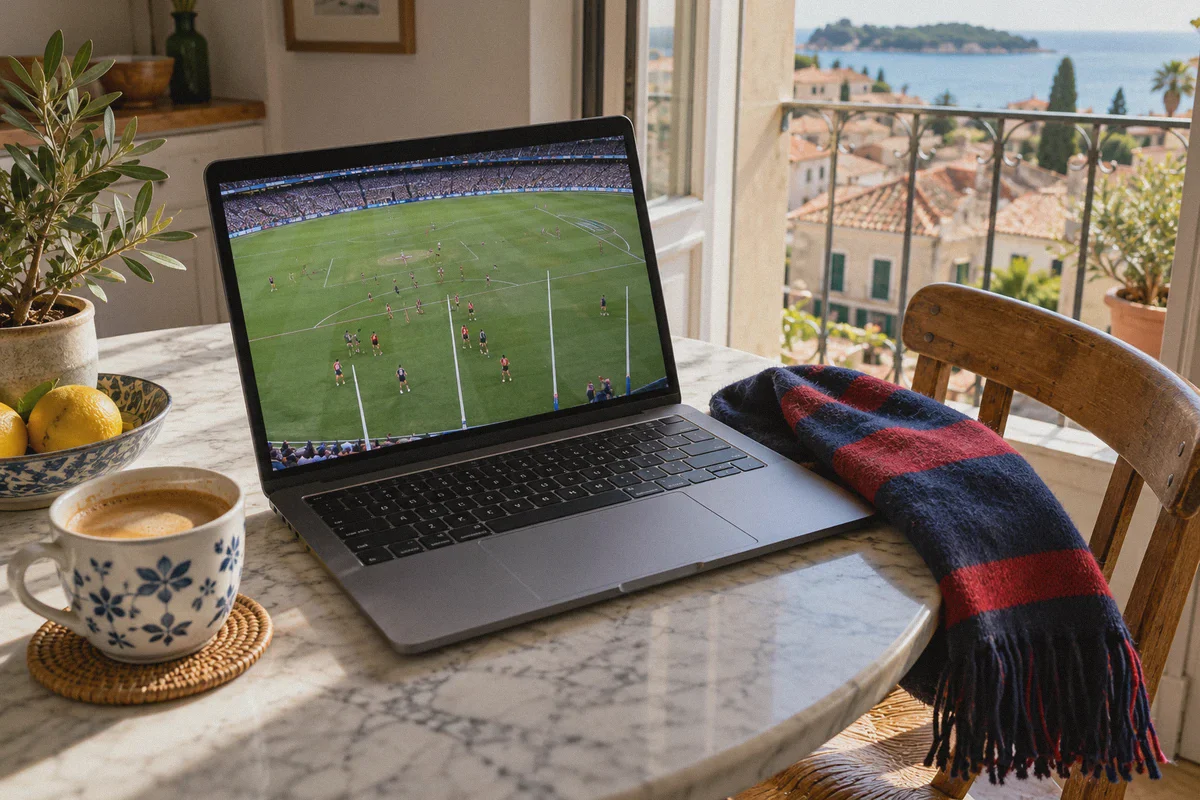 Australian rules football playing on a laptop abroad.