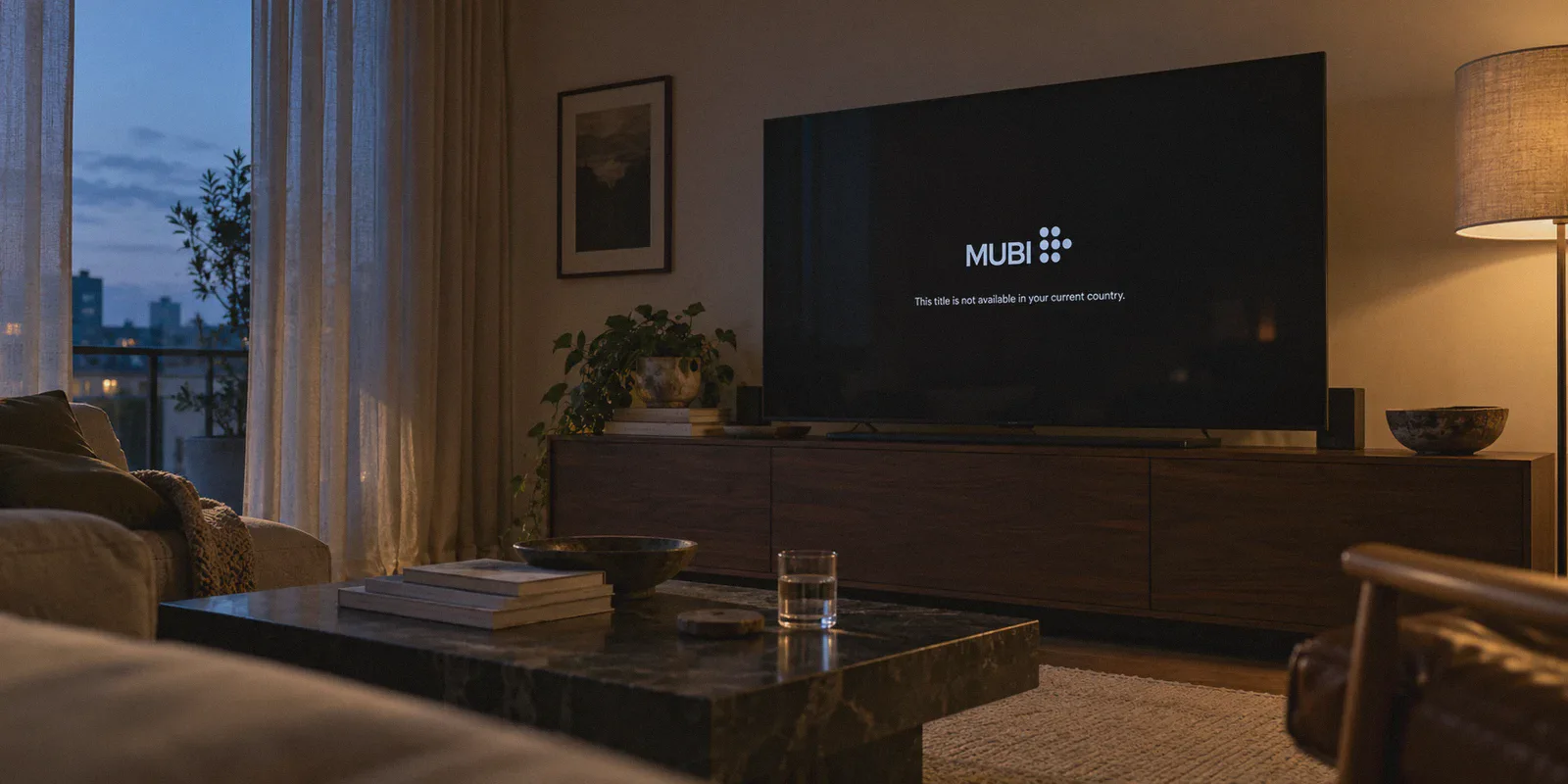 Film-night television showing a regional availability message.