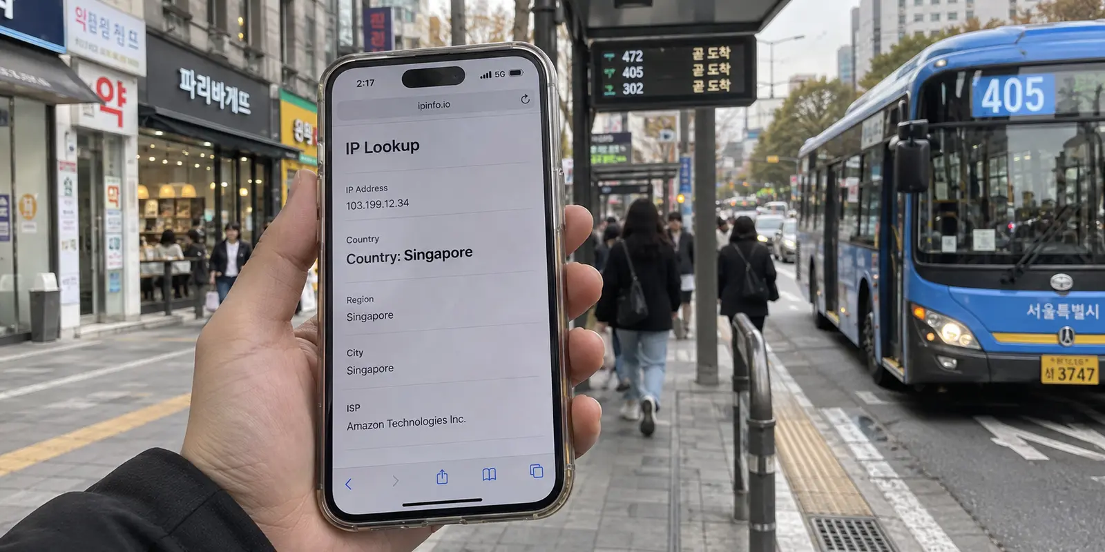 A phone on a Seoul street has 5G service but its IP lookup country is Singapore