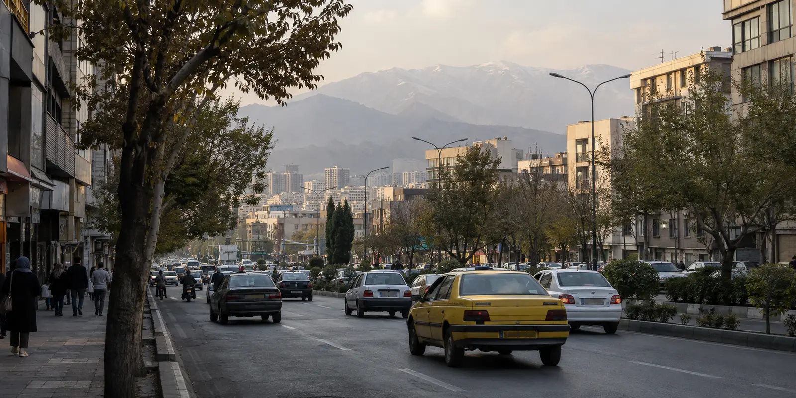 An everyday Tehran avenue with the Alborz Mountains beyond the city