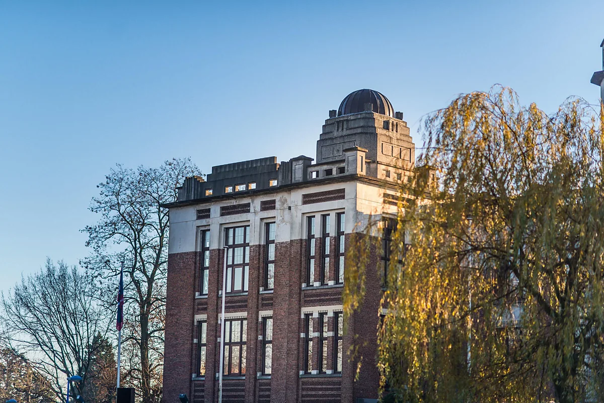 A European city building in autumn light, representing travel within Europe.