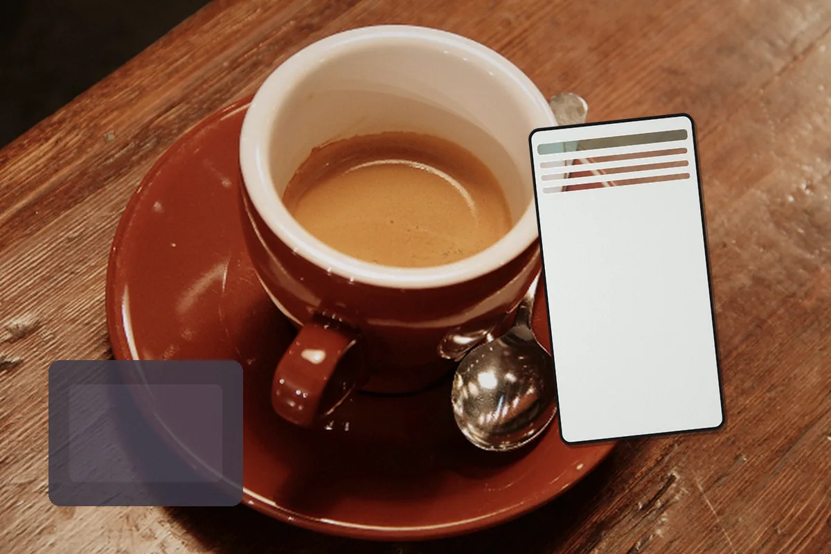A smartphone beside coffee and a travel document sleeve during a direct mobile session