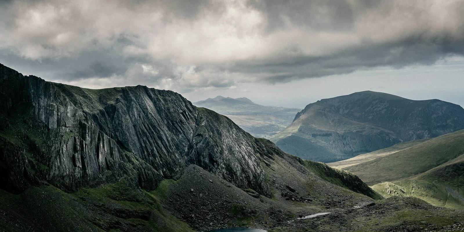 Cloudy mountain valley in a remote landscape, evoking an Iceland road trip.