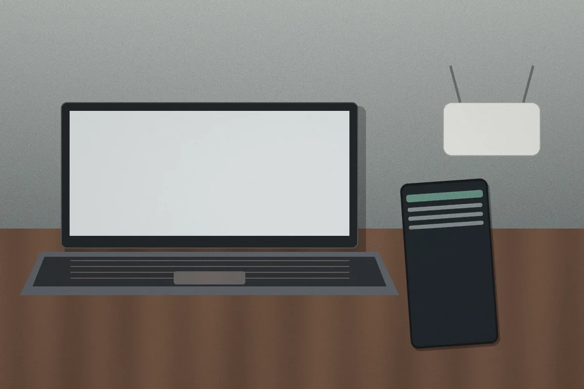 A laptop tested with a smartphone while a home router sits in the background