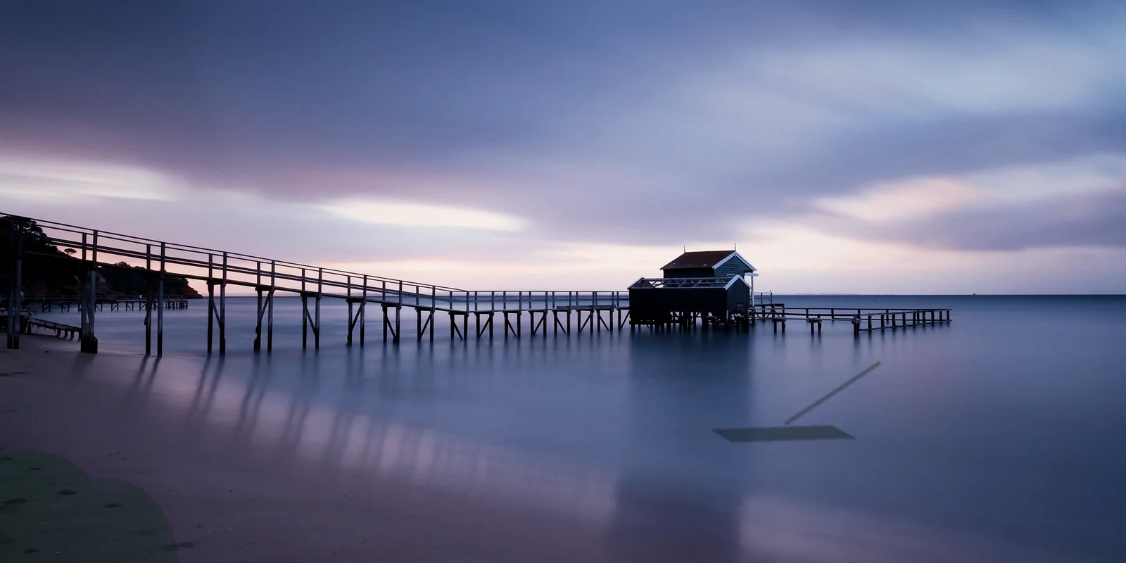A Bangkok-area travel setting at blue hour with water and a pier